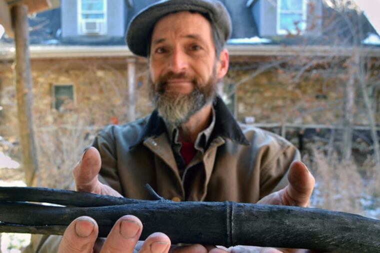 Dale Hendricks, owner of Green Light Plants, holds bamboo biochar.