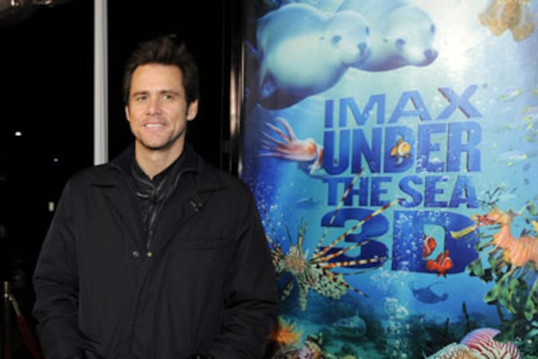 Jim Carrey, who narrates the IMAX film "Under the Sea 3D," arrives at a special screening of the film at the California Science Center IMAX theater in Los Angeles, Thursday, Feb. 5, 2009. (AP Photo/Chris Pizzello)