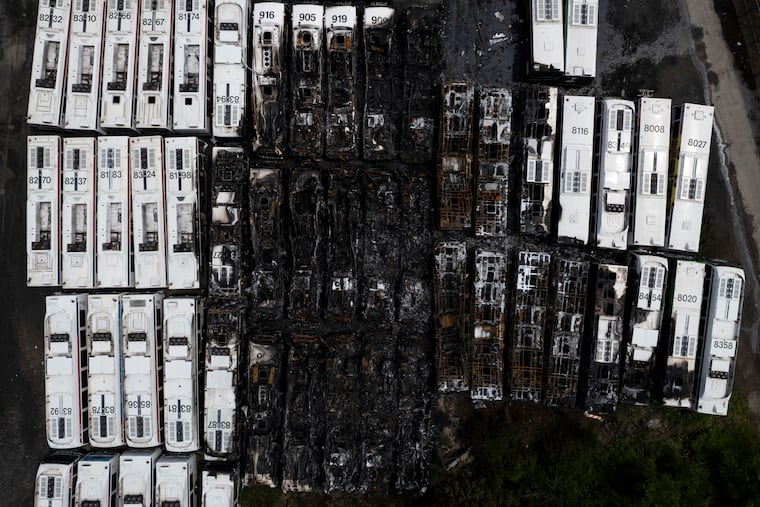 The aftermath of a large fire engulfing multiple SEPTA buses at the Roberts Yard SEPTA Railroad Facility in Nicetown on Thursday. Officials said 40 buses in the lot were damaged by the fire.
