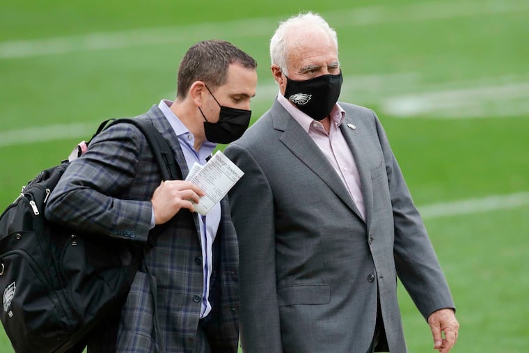 Eagles owner Jeffrey Lurie (right) and general manager Howie Roseman (left) have been quiet to this point during NFL free agency.