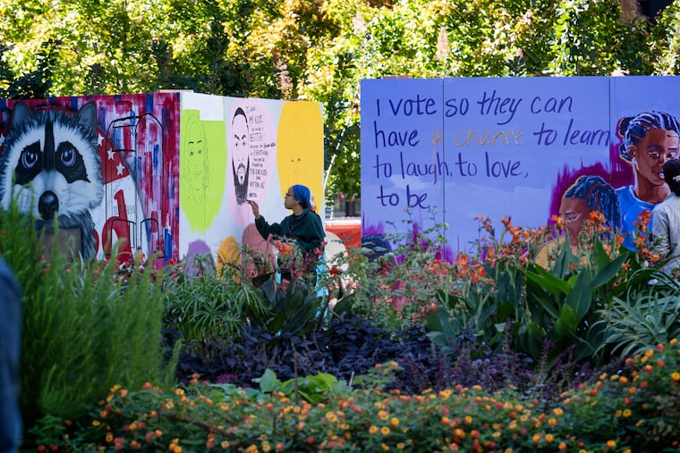 In Love Park in Center City Philadelphia, mural artists work on "To The Polls" murals to encourage folks to go vote.