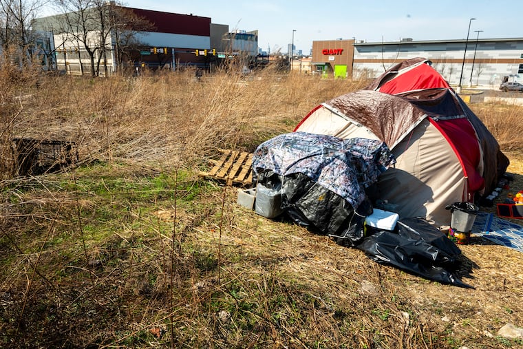 Camp Chloe the community of tents and huts in a fenced-off, grassy clearing by the Giant Store in South Philly that will soon be scattered.