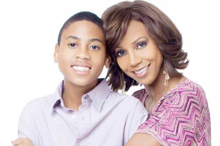 Peete and RePeete: Holly with son RJ, who has some game like his dad. (But it’s basketball). (Photo: Christohper Voelker)