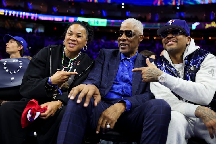 Dawn Staley (left) sits alongside other Philadelphia basketball royalty: Julius Erving (center) and Allen Iverson (right).