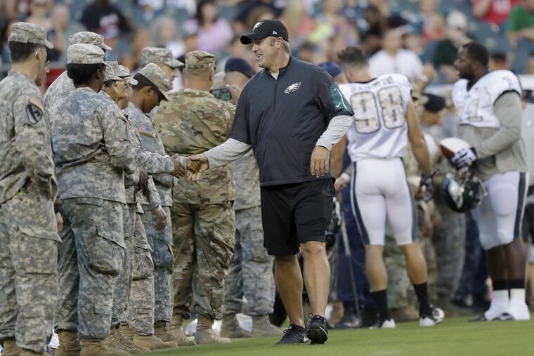 Eagles Head Coach Doug Pederson greets military members before the Eagles practiced at Lincoln Financial Field on Sunday, August 14, 2016 in Philadelphia. YONG KIM / Staff Photographer