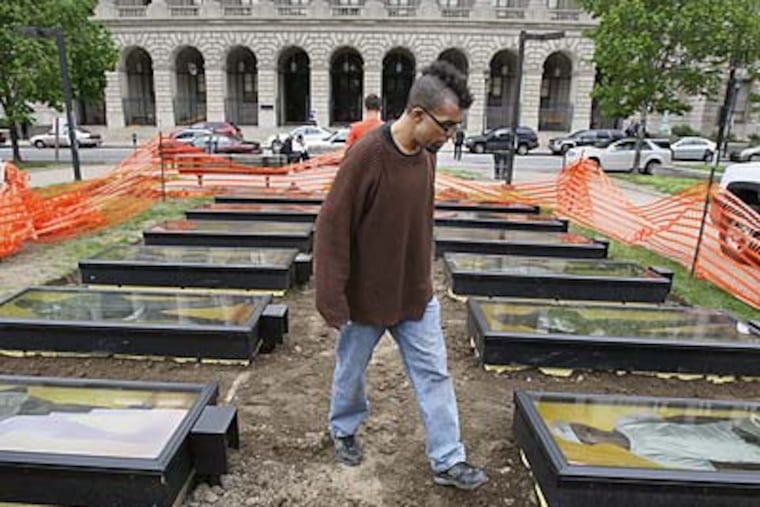 Students in the ArtWorks! department of the Mural Arts Program worked with New York-based artist Dread Scott to create the project, titled <i>. . . Or does it Explode?</i> (Elizabeth Robertson/Staff Photographer)