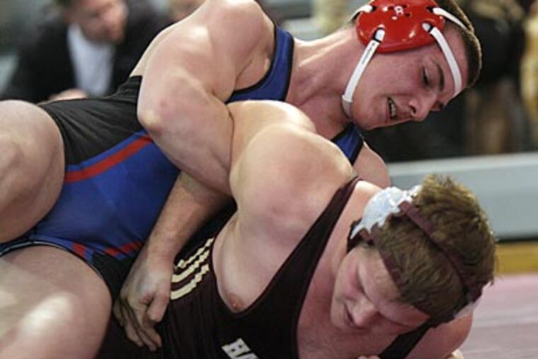 Germantown Academy’s Nicholas Grossi (top) works on Haverford School’s Chris DiBello. (Lou Rabito/Staff)