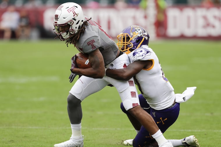 Temple wide receiver Isaiah Wright runs with the football against East Carolina defensive back Daniel Charles on Saturday, October 6, 2018. YONG KIM / Staff Photographer