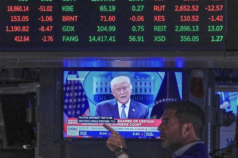 President Donald Trump appears on a television screen on the floor of the New York Stock Exchange in February.