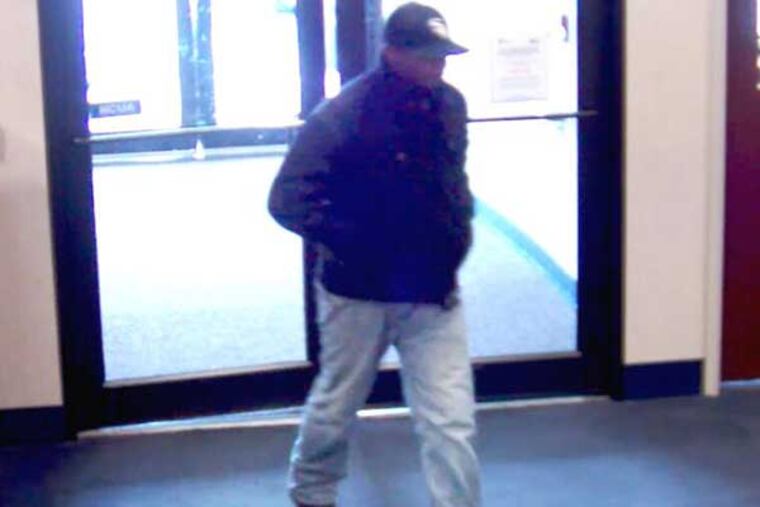 Surveillance photo of a suspect in three bank robberies at a Police and Fire Federal Credit Union branch in Philadelphia. This image was captured during the most recent incident, on Oct. 31, 2013. (Courtesy of the FBI)
