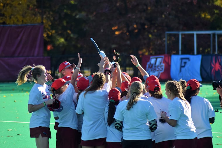 Saint Joseph's players celebrate with the Atlantic 10 Tournament Championship Trophy – Nov. 3, 2018