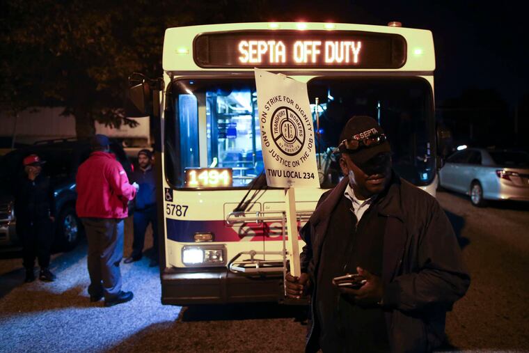 William Chery, a member of TWU Local 234, mans a picket line early Tuesday outside SEPTA's Comly Depot in the Northeast as the strike, which affects bus, trolley, and subway service, begins. SEPTA said it might seek an injunction to guarantee Election Day service.