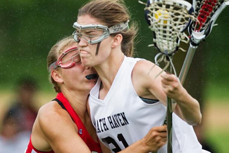 Strath Haven's Kirsten Wilheimsen, right, muscles her way past Harriton's Hilary Lemonick. (Ed Hille/Staff Photographer)