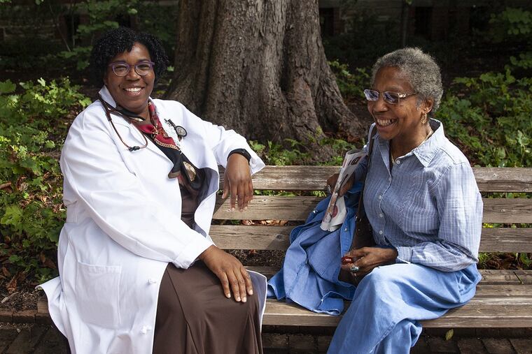 Lisa Walke, chair of geriatric medicine at Penn Medicine, speaks with patient Mary Ann Lancaster Tyler outside of the Penn Ralston Center.