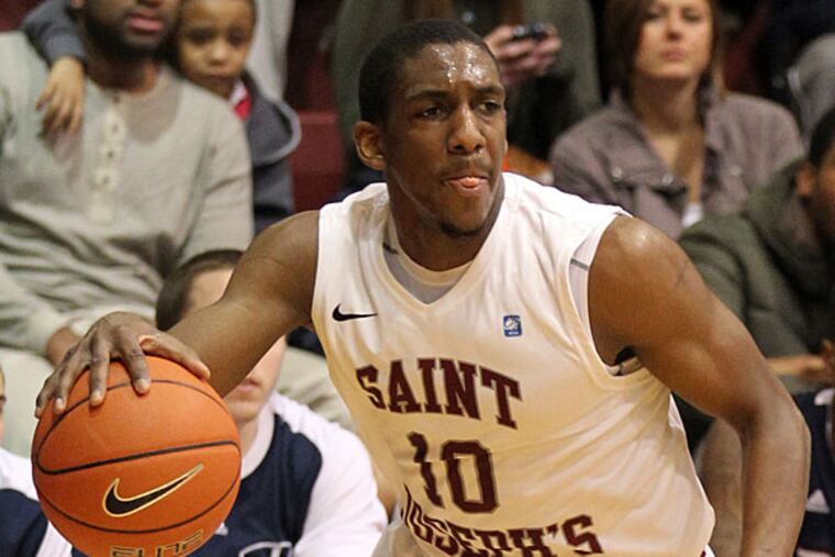 Saint Joseph's Langston Galloway dribbles the ball against Duquesne. (Yong Kim/Staff Photographer)