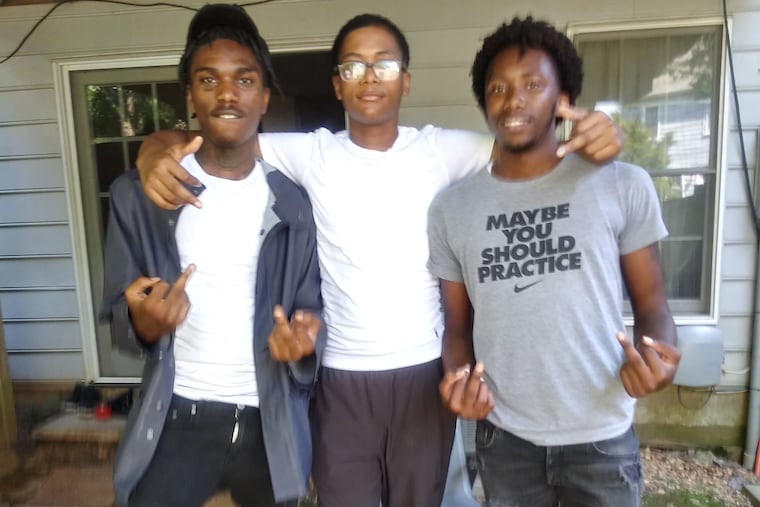 Aamir Johnson-Daye, pictured on the left, with Azeem Daye (middle) and Ameen Daye (right).