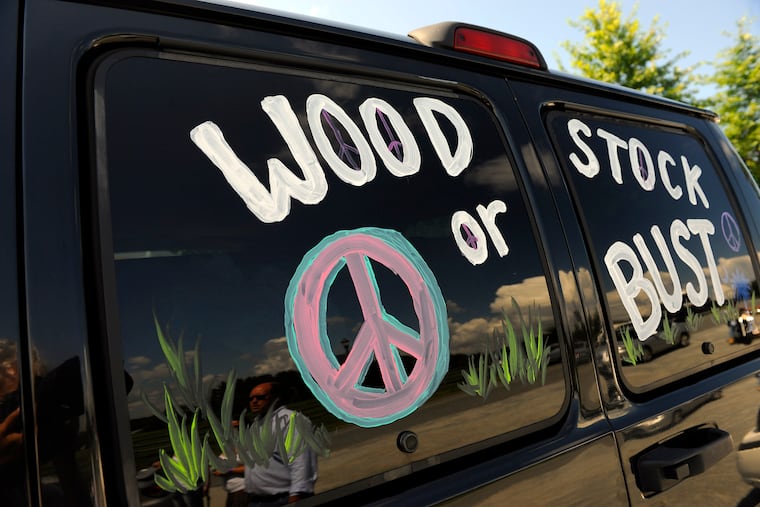 FILE - This Aug. 14, 2009, file photo shows a van decorated with "Woodstock or Bust" at the original Woodstock Festival site in Bethel, N.Y. Woodstock 50 is proving to be as chaotic as the original festival held in 1969. A financial investor in the festival announced Monday, April 29, 2019, it was pulling its funding from the anniversary event, set to take place Aug. 16-18 in Watkins Glen, N.Y.