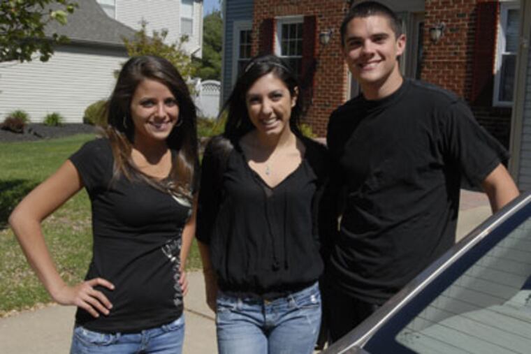Cherokee High School seniors Nicolette Benton and Shana Mullen and junior Pat Beaver stands in front of Pat's car in Evesham. (Ron Tarver / Staff Photographer)