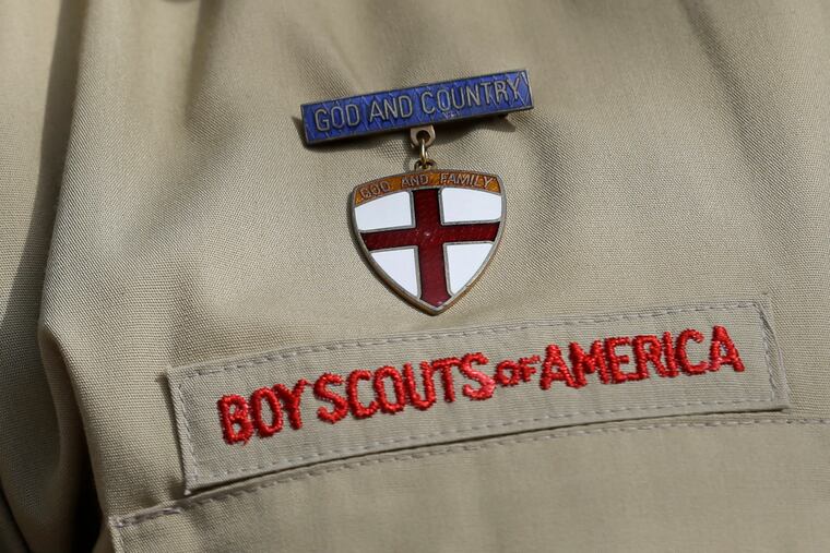 A federal district court judge upheld the approval of a $2.4 billion bankruptcy reorganization plan aimed at resolving tens of thousands of child sexual abuse claim against the Boy Scouts of America.