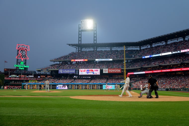 Nick Castellanos hits a foul ball in the sixth inning on Tuesday with hazy skies as the backdrop.
