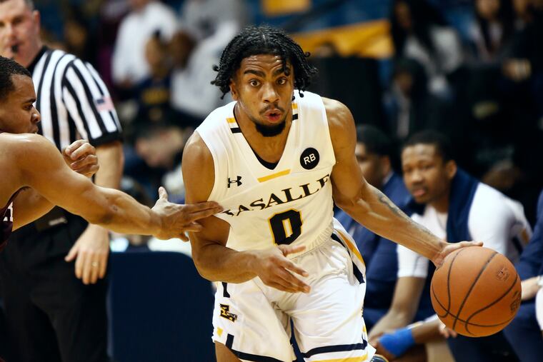 Pookie Powell drives past Fordham's Nick Honor during the second half of the Explorers' win on Saturday.
