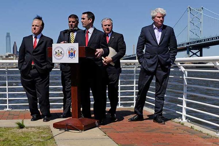 Pennsylvania and New Jersey legislators team up on the Camden Delaware River Waterfront for a news conference Thursday to propose sweeping changes to the federal charter of the Delaware River Port Authority, to make it more accountable and transparent. At the microphone is Pa. Auditor General Eugene DePasquale. Behind him, from left are, N.J. Sen. Joe Pennacchio; Pa. Rep. Mike Vereb; Pa. Sen. John Rafferty, chairman of the Pa. Senate Transportation Committee; and Philadelphia union leader and DRPA board member John "Johnny Doc" Dougherty Jr.