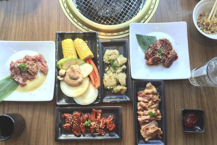 Overhead view of the “premium party set” lunch deal for two at Gyu-Kaku on Callowhill Street behind the Free Library. (Photo by Craig LaBan)