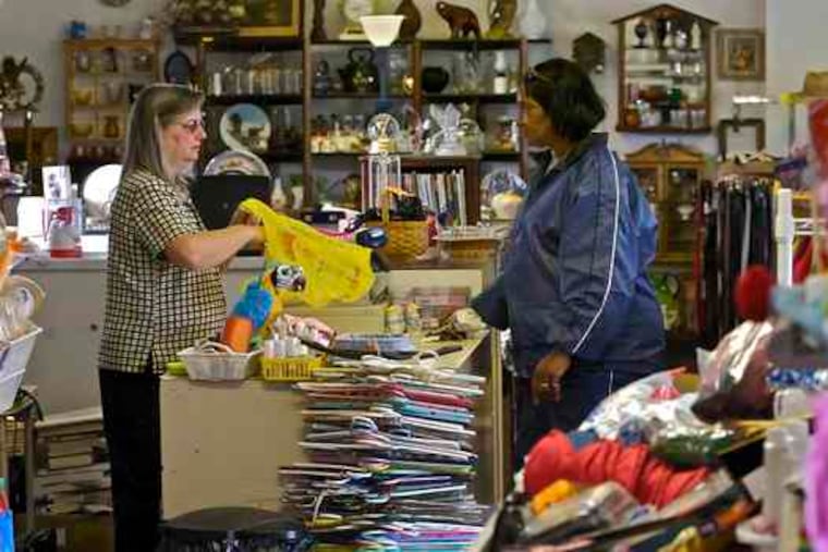 Owner Barbara DeNero assists Julie Singh at Treasure Chest Thrift, in Berlin, Camden County.