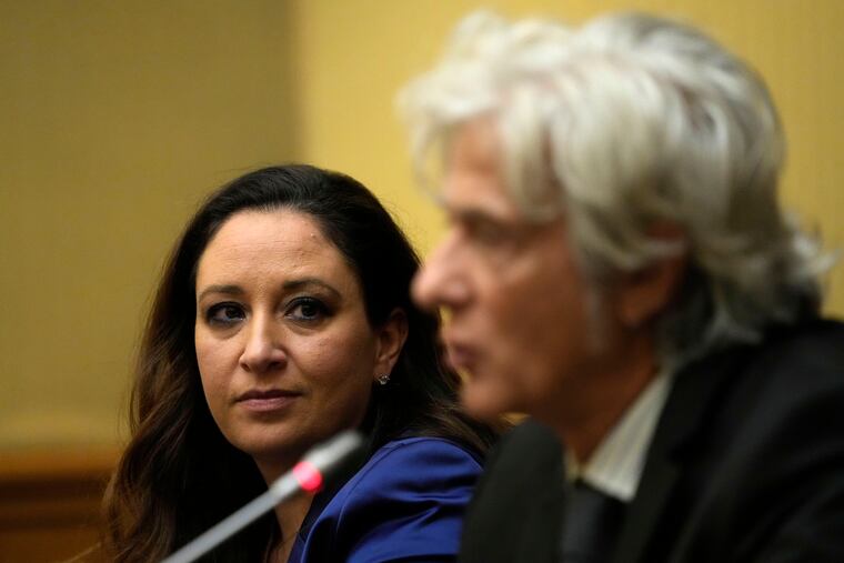 Lawyer Laura Sgro, left, listens to her client Pietro Orlandi, brother of Manuela, a 15-year-old daughter of a Vatican employee who disappeared in 1983, during a press conference on the establishing of a parliamentary investigative commission on Manuela Orlandi and other cold cases, in Rome, in December.