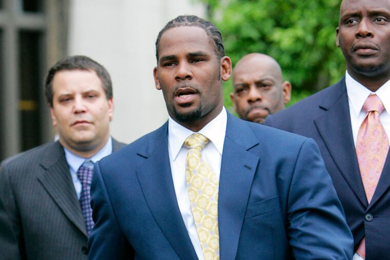 FILE - In this June 13, 2008 file photo, R&B singer R. Kelly leaves the Cook County Criminal Court Building in Chicago after a jury found him not guilty on all counts in his child pornography trial. In 2002, Kelly was indicted on 21 counts of child pornography, based on a videotape allegedly showing him having sex with an underage girl. (AP Photo/Nam Y. Huh, File)