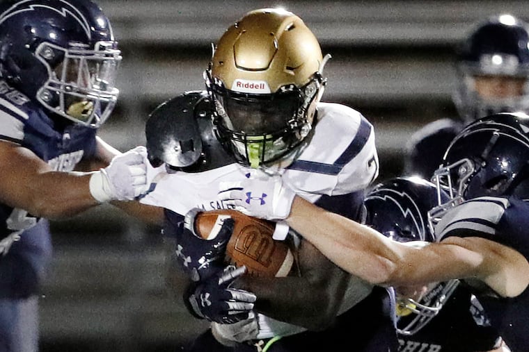 La Salle’s Samuel Brown runs the ball against Manheim Township last Friday.