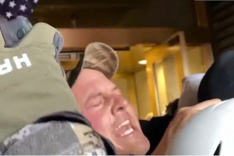 Ezekiel Stecher is seen in video footage taken during the battle for control of the U.S. Capitol building's lower west tunnel entrance during the Jan. 6, 2021 attack on the building.