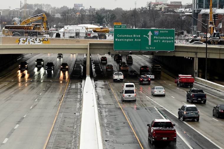 Traffic moves on I-95 near Penn’s Landing passing under the Chestnut Street bridge, which closed on Jan. 15 as part of an ongoing project to build a cap over the highway.