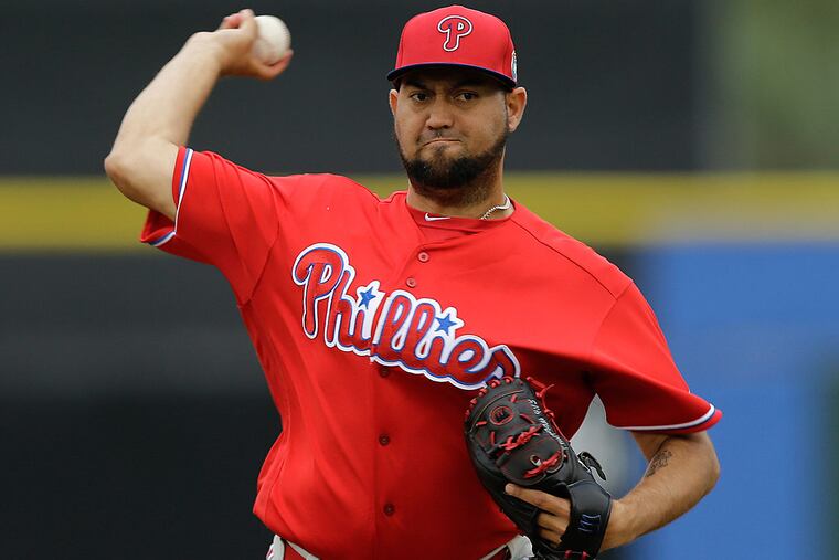 Philadelphia Phillies relief pitcher Edward Mujica warms up during a spring training baseball game against the Toronto Blue Jays Monday, March 28, 2016, in Dunedin, Fla.