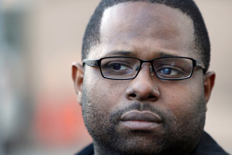 File photo: Traffic court judge Willie Singletary listens to his attorney talk outside after he appeared in Federal Courthouse in Philadelphia, Pa., on January 31, 2013. ( DAVID MAIALETTI / Staff Photographer )