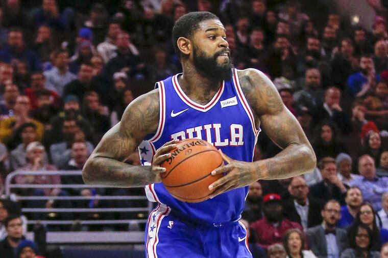 Amir Johnson is staying in Philadelphia.