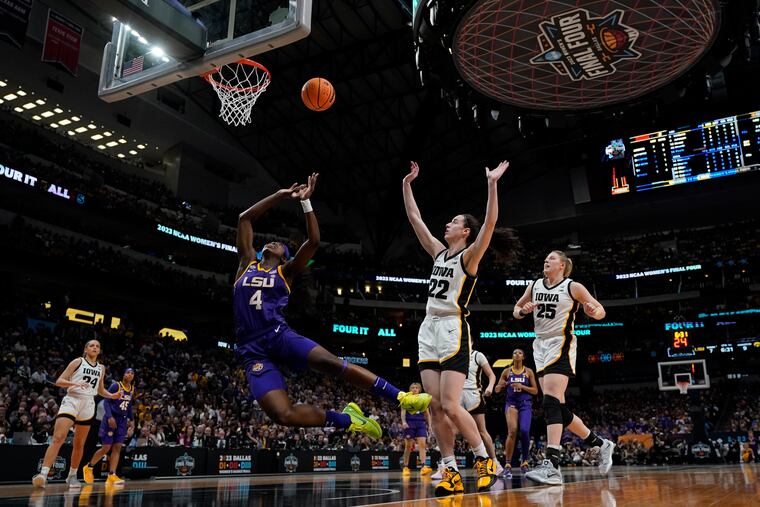 LSU's Flau'jae Johnson (4) is fouled by Iowa's Caitlin Clark during the first half of the NCAA championship game. The game, won by LSU, drew nearly 10 million viewers.