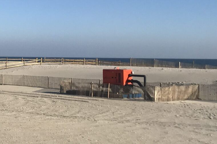 Orange pumps are temporary solutions to the drainage problem created by the dunes in Margate. They will remain on the beach until work is completed on a permanent drainage solution, which will take one year.
