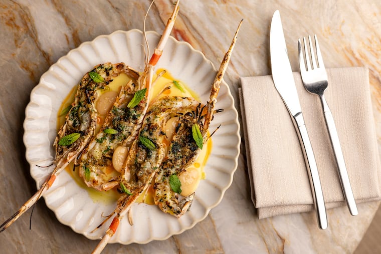 The half-grilled langostinos with preserved lemon curd, butter beans, and mint at Bastia at the Hotel Anna & Bel in Philadelphia.