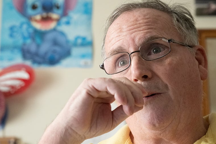 Chris Balch, 61, at his home in Narberth, where he lives with his 9-year-old daughter. Battling cancer, Balch is the subject of a fundraising video by the Jewish Relief Agency.