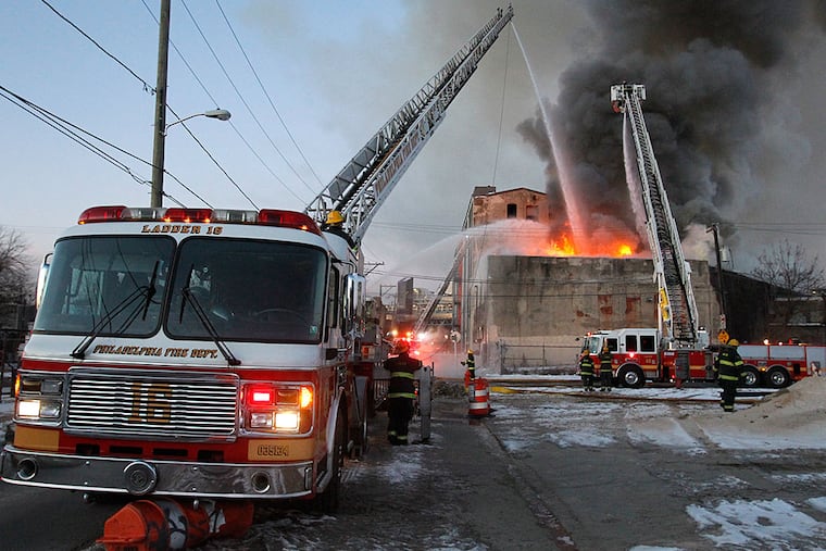 Firefighters work on the blaze on North Front Street. ALEJANDRO A. ALVAREZ / Staff Photographer