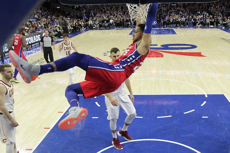 Ben Simmons, center, of the Sixers dunks against the Cavaliers at Wells Fargo Center during the 2nd half on March 12, 2019.