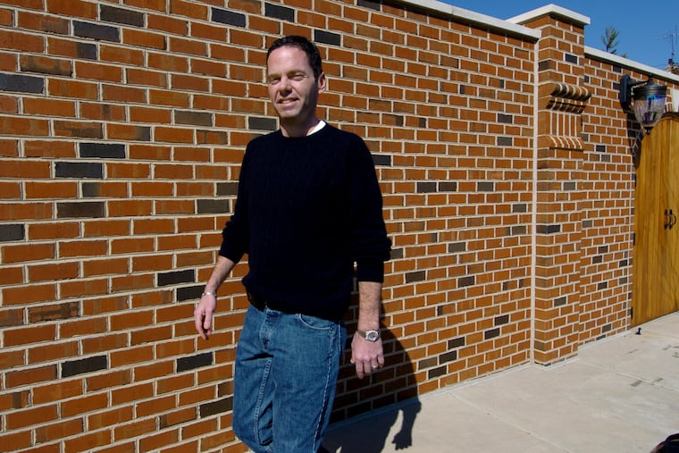 Donald "Gus" Dougherty, seen here in April 2006, is charged with altering financial records and lowering the amount of federal taxes he was required to pay.