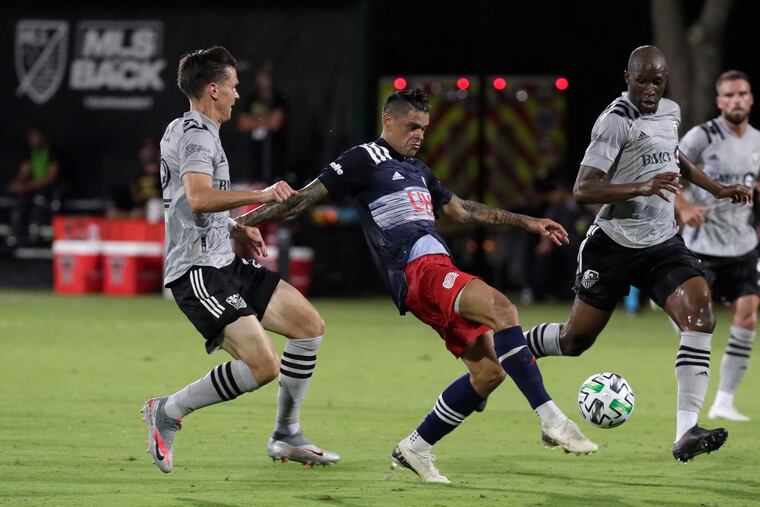 Gustavo Bou, center, scored for New England against Montreal.