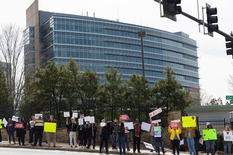 Demonstrators protest Centers for Disease Control and Prevention (CDC) layoffs in front of the CDC headquarters in Atlanta, Feb. 18, 2025.