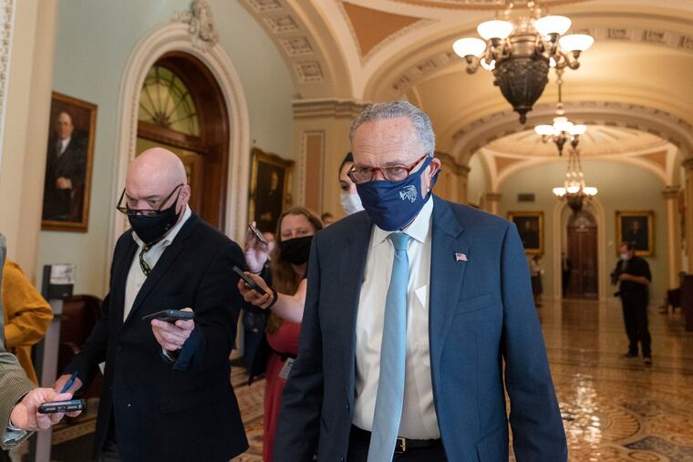 “We’re working hard, we’re making progress, and we’re shooting to get it done by Oct. 31,” Senate Majority Leader Charles E. Schumer (right) says.