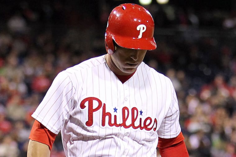 Laynce Nix walks back to the Phillies dug out after striking out to end the eighth inning with two men on base against the St. Louis Cardinals on Thursday, April 18, 2013. (Yong Kim/Staff Photographer)