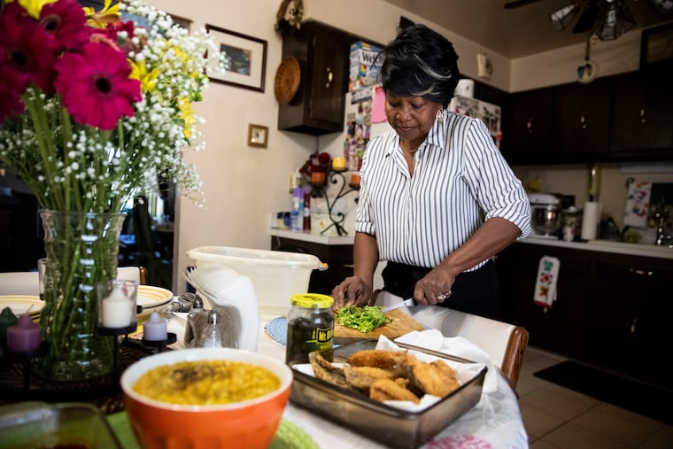 Brenda Whitfield chops cabbage at her home in Philadelphia, Pa. on Friday, February 21, 2020. Whitfield is the oldest of 11 children and was born in Mt. Olive, North Carolina.