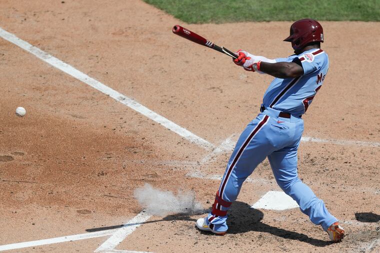 Phillies Andrew McCutchen hits into a third-inning fielder's choice to plate a run during Game 1 of the doubleheader against the Atlanta Braves on Sunday, August 9, 2020.