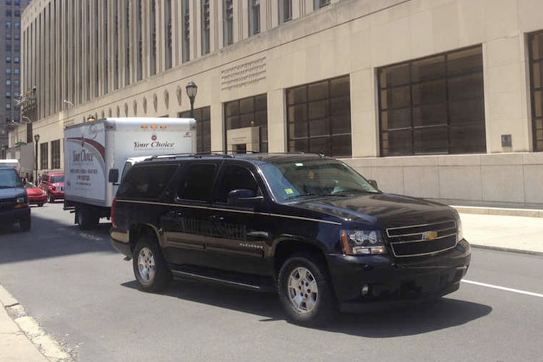 Omar Alameddin's Chevy Suburban, in which he takes calls for Uber as well as for Four Seasons Limousine Service.